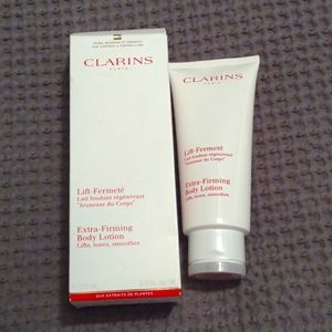 CLARINS  extra firming body lotion. new in box. Sealed.